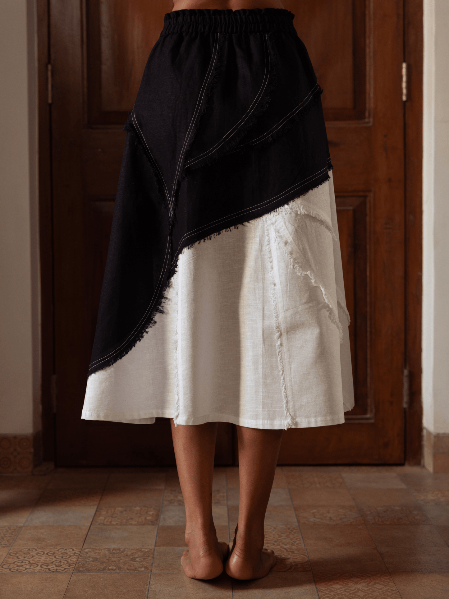 Luxury asymmetrical skirt with hand-frayed detailing